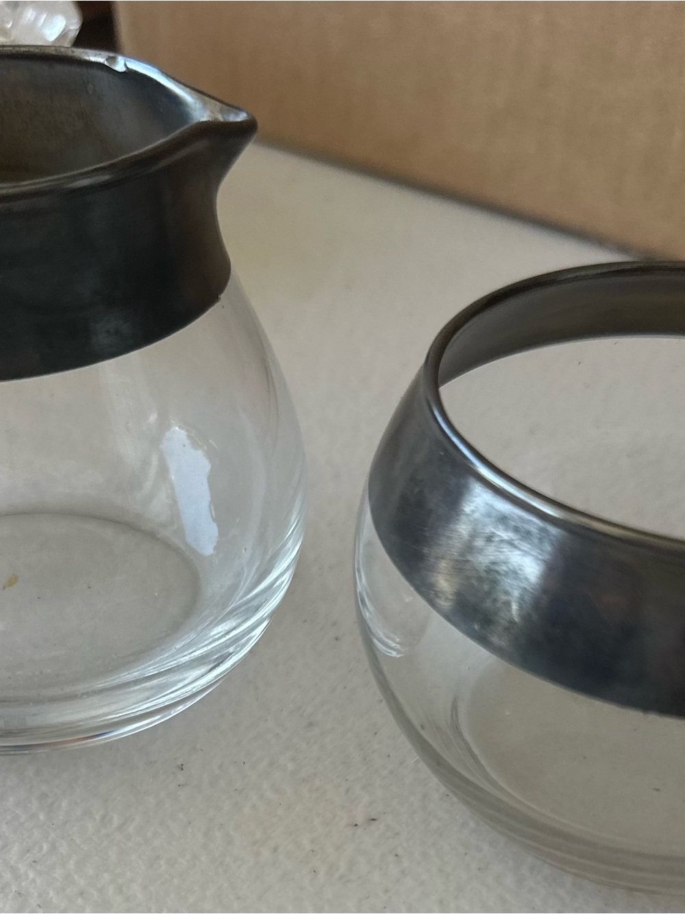 This mid-century modern Dorothy Thorpe silver-banded creamer and sugar bowl set
